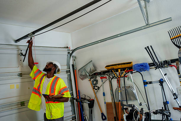 Professional Garage Door Spring Repair technician working in Tawas City, MI
